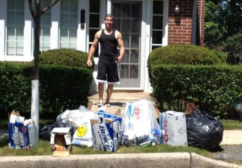 Joey walking behind a mountain of booze.